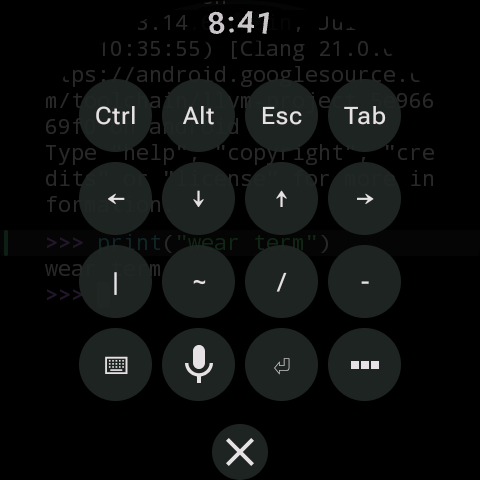 Expanded key pad with Ctrl, Alt, Esc, Tab, arrow keys, pipe, tilde, slash, dash, keyboard, microphone and enter